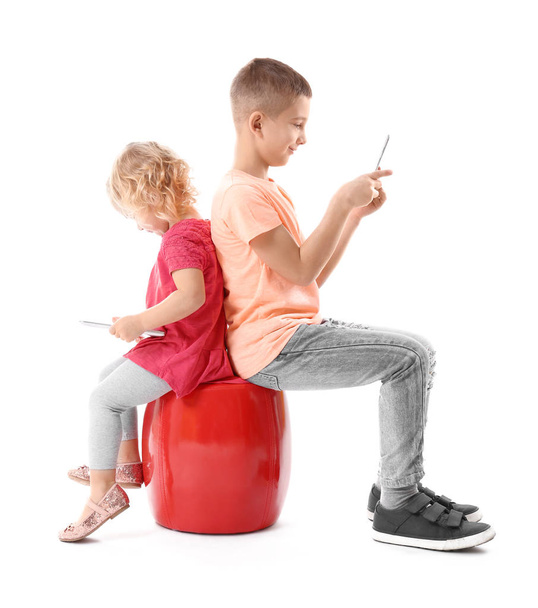 little brother and sister with gadgets - Foto, Bild