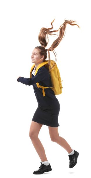Teenage girl with backpack on white background - Foto, afbeelding