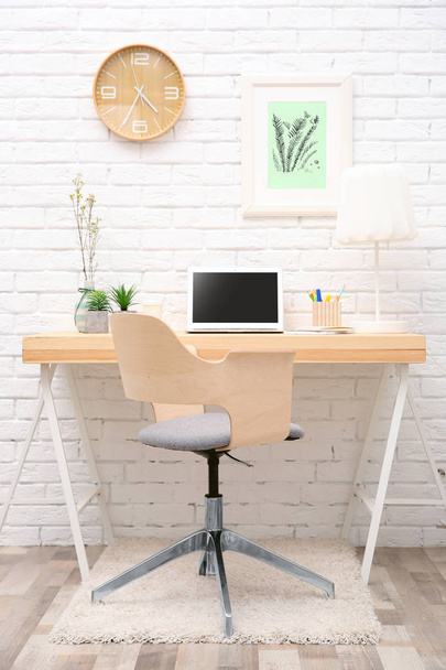 Workplace with laptop on desk   - Foto, Bild