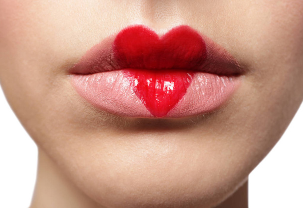 Beautiful woman with heart painted on lips - Foto, Imagem