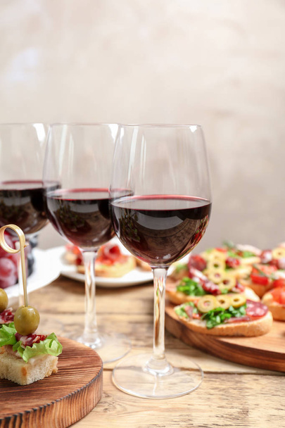 Wine with tasty bruschetta  - Photo, image