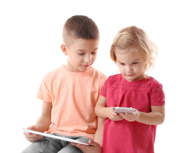 little brother and sister with gadgets - Foto, Imagem