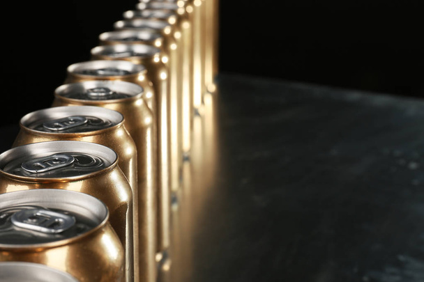 golden cans of beer  - Фото, изображение