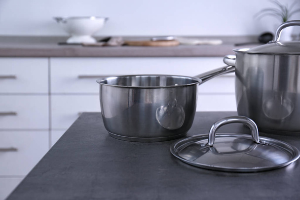 Metal pans in kitchen - Fotó, kép