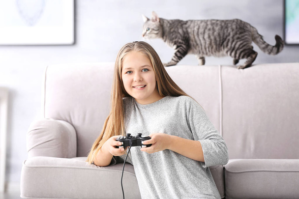  teenager playing videogame  - Фото, изображение
