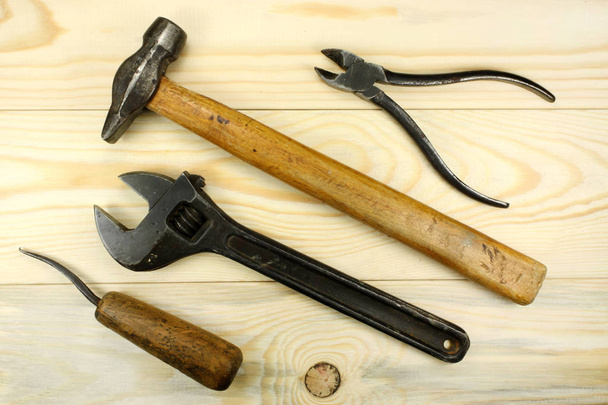 Construction tools on a wooden table - Фото, изображение