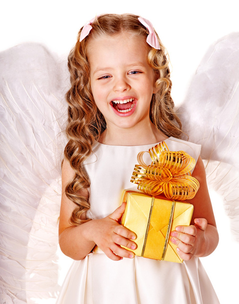 Child at angel costume holding gift box. - Photo, Image