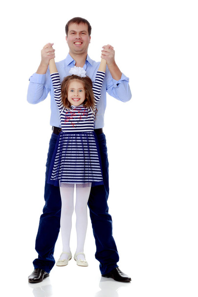Dad holding daughters hands. - Photo, image