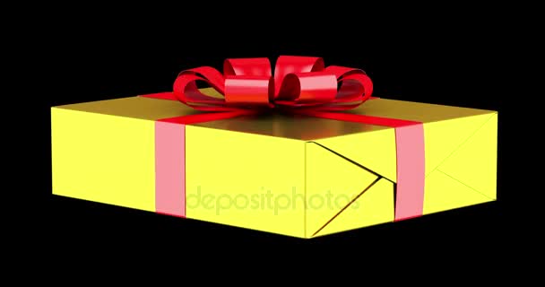 gift box with red ribbon and bow loop rotate on black background - Footage, Video