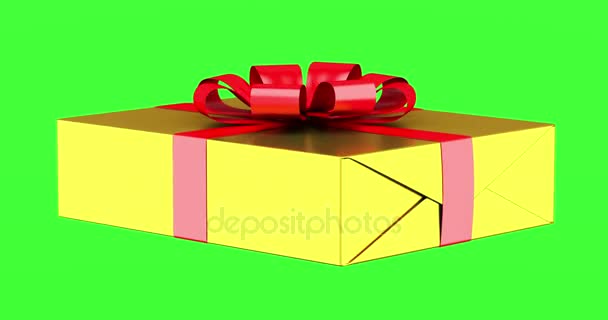 Geschenkbox mit rotem Band und Schleife drehen sich auf grünem Chromakey-Hintergrund - Filmmaterial, Video
