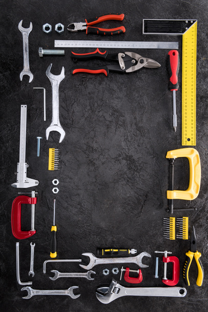 top view of set of various work tools on black - Photo, Image