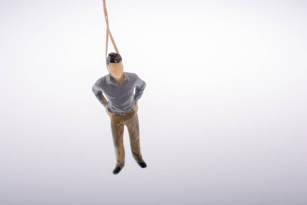 Man  figurine tied  with aa rope  - Foto, Imagem