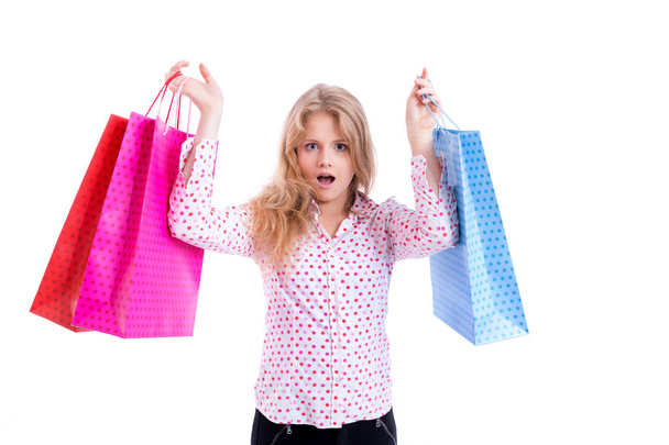 shocked girl with shopping bags - Фото, изображение