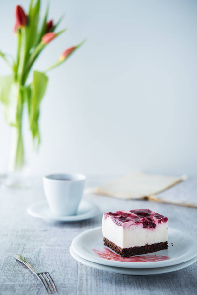 Delicious and sweet cheesecake with cherry jelly - Foto, imagen