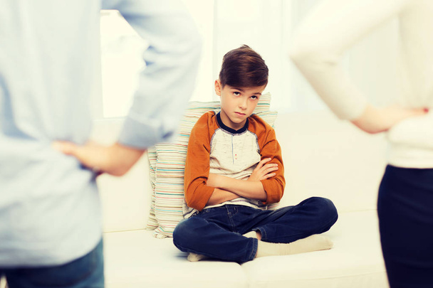 upset or feeling guilty boy and parents at home - Foto, Imagem