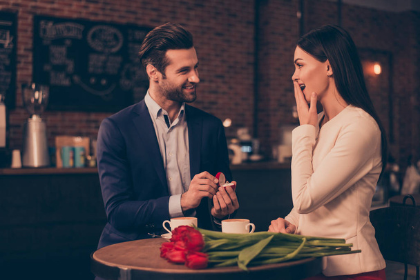 A happy man making proposal in a cafe  - Фото, изображение