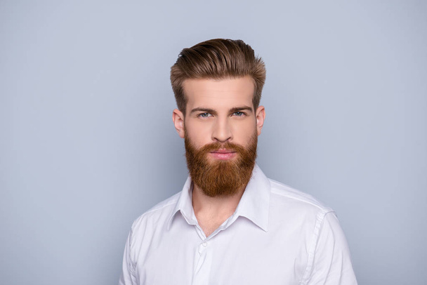 Portrait of confident bearded man in white shirt - Fotó, kép