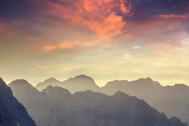 Beautiful landscape. Silhouette of mountains against the sunset  - 写真・画像