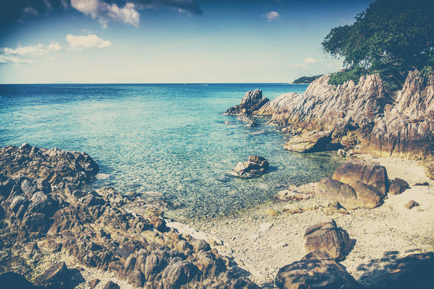 Beautiful stony sea shore. Tropical landscape. Image with retro  - Photo, Image