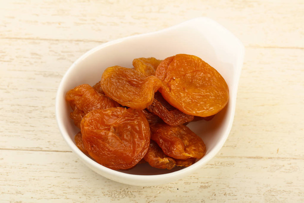 Dried apricots in the bowl - Photo, Image