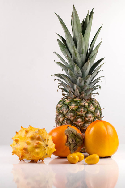 Fresh fruits on white background. Assorted tropical fruits. - Foto, Imagen
