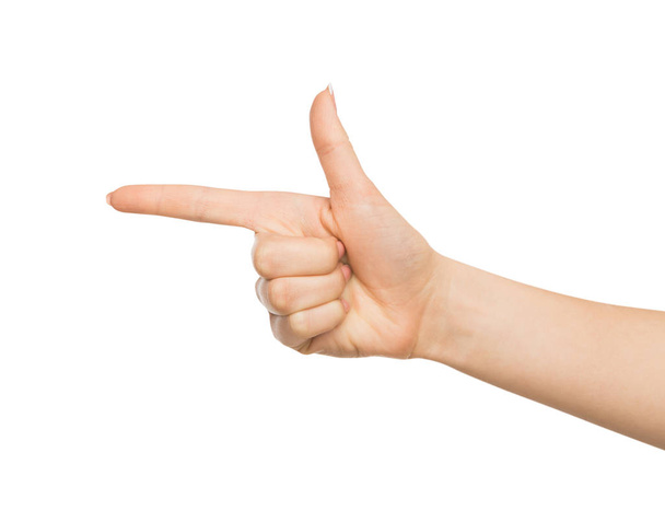weibliche Hand zeigt mit Zeigefinger auf Objekt - Foto, Bild