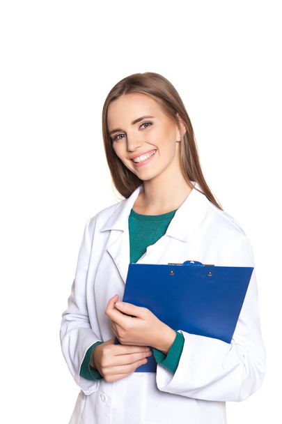 young female doctor with a blue tablet on a white background - Фото, изображение