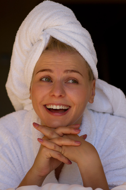 Laughing blond girl in bathrobe and towel - Фото, изображение