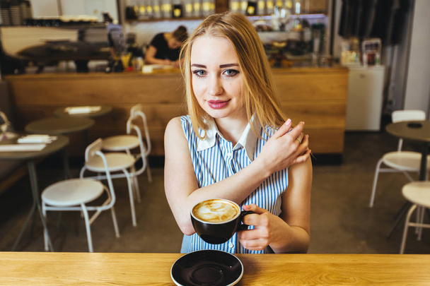 woman drinking coffee in cafe - Photo, Image