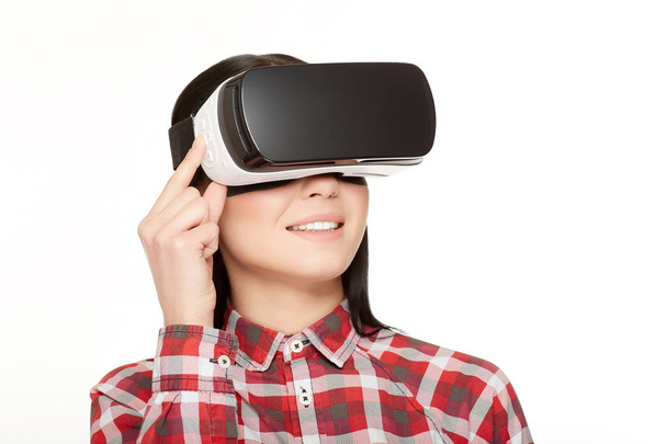 Woman in VR headset press buttons and watching video. - Foto, Imagem
