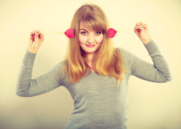 Cheerful girl fooling with hearts. - Foto, immagini