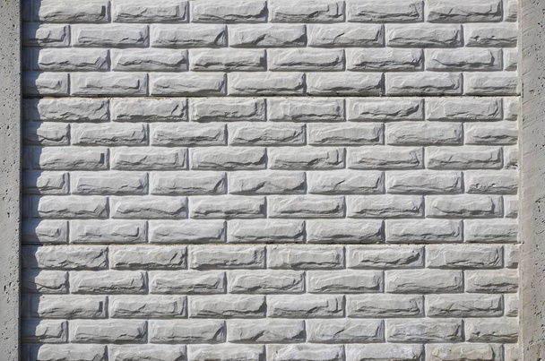 Kamienne ogrodzenia tekstury - budynek funkcji. Tekstura betonowe ogrodzenie z ulga i tekstury, takie jak kamienne ściany - Zdjęcie, obraz