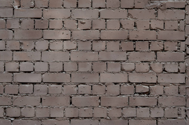 A textura da parede de uma variedade de tijolos velhos e sujos. Padrão detalhado de uma pluralidade de tamanhos diferentes de tijolo desgastado
 - Foto, Imagem