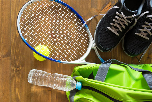 green bag for sports racket for tennis on the floor - Fotografie, Obrázek