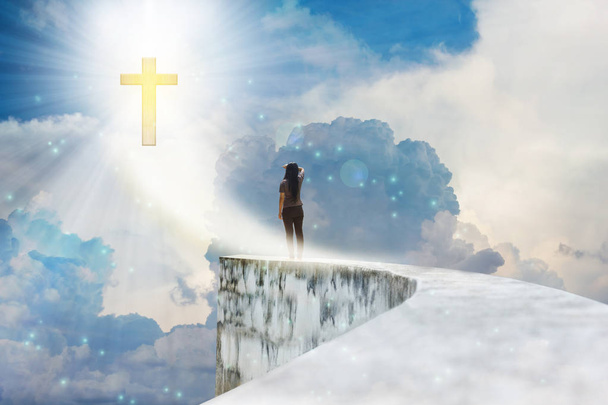 Crucifix or cross on heaven cloudy sky with lens flare and backs - Foto, Bild