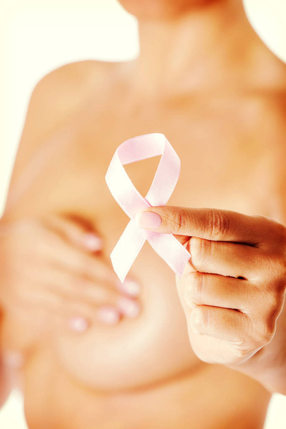 Topless woman with pink breast cancer ribbon. - Zdjęcie, obraz
