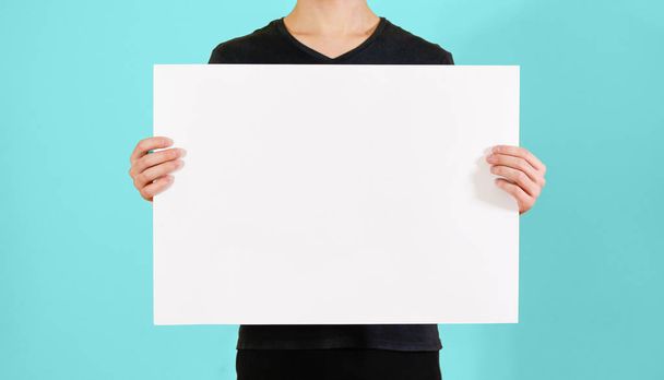 Man showing blank white big A2 paper. Leaflet presentation. Pamp - Фото, зображення