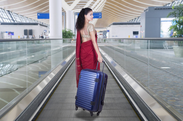 Indian tourist with bag in airport - Photo, image