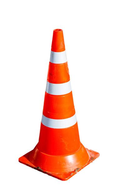 Emergency striped cone standing on the pavement. - Photo, Image