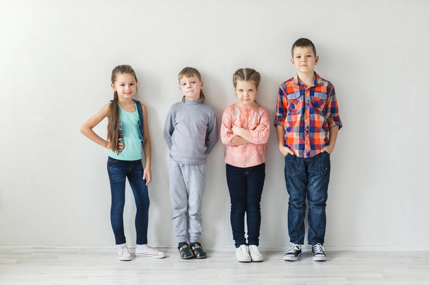 portrait of cute little kids in wear clothes looking at camera and smiling - Fotoğraf, Görsel
