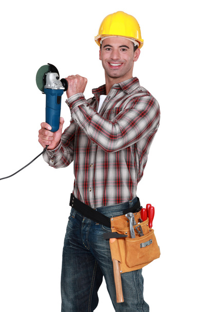 Cheerful manual worker holding angle grinder - Zdjęcie, obraz
