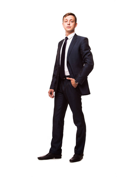 Stylish young man in suit and tie. Business style. Handsome man standing and looking at the camera - Фото, зображення