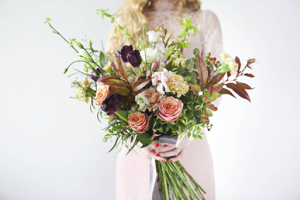 Unusual wedding stylish bouquet in hands of a bride  - 写真・画像