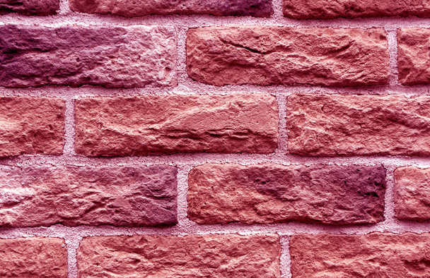 Pink toned brick wall surface.  - Foto, afbeelding