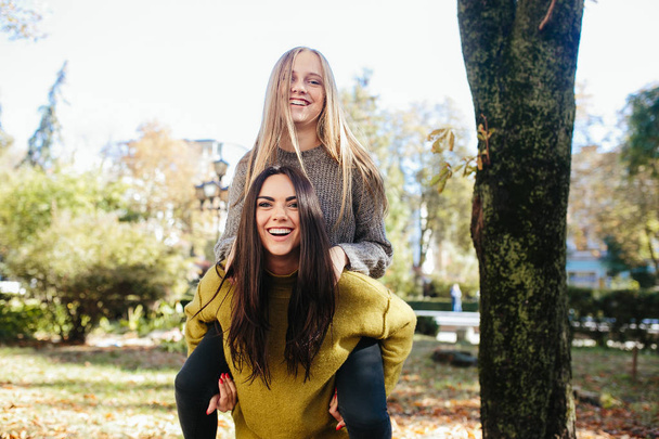 Two girls having fun in the park - Photo, Image