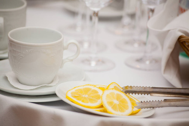 Cup of tea with lemon on table close-up. - 写真・画像