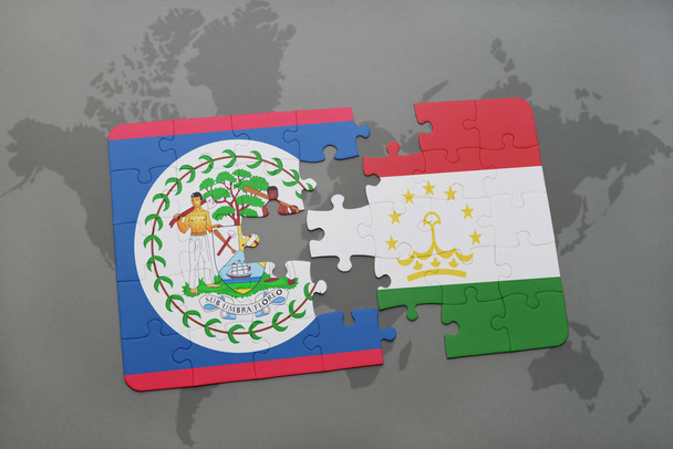 παζλ με την εθνική σημαία του Μπελίζε και Τατζικιστάν σε έναν παγκόσμιο χάρτη - Φωτογραφία, εικόνα