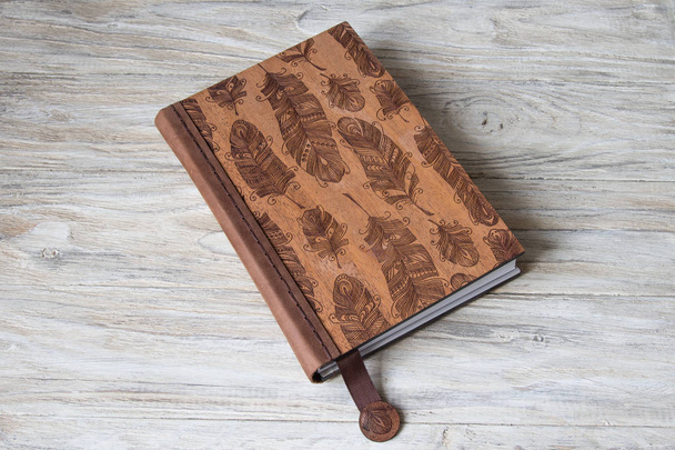 Blank notebook on a wooden background - Φωτογραφία, εικόνα