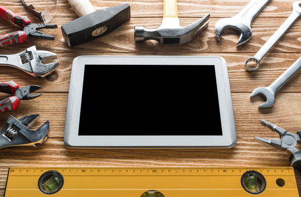 Variety of tools of builder and tablet pc - Φωτογραφία, εικόνα