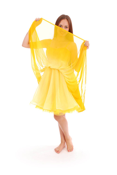 Full body portrait of young woman in yellow dress.  - Foto, Bild